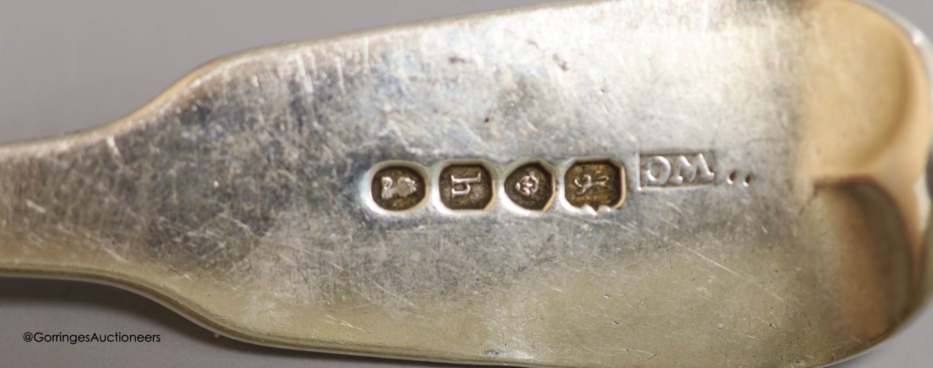 Four George III silver forks, six spoons, a later bottle coaster and a napkin ring
